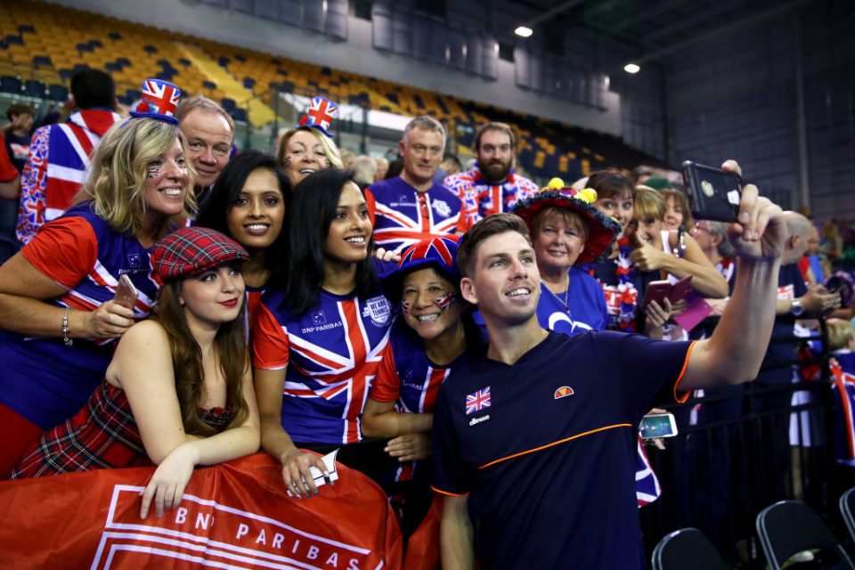 GLASGOW, SCOTLAND - SEPTEMBER 16:  Cameron Norrie of Great Britain celebrates with fans after winning his match against Sanjar Fayziev of Uzbekistan during day three of the Davis Cup by BNP Paribas World Group Play off between Great Britain and Uzbekistan at Emirates Arena on September 16, 2018 in Glasgow, Scotland.  (Photo by Clive Brunskill/Getty Images)