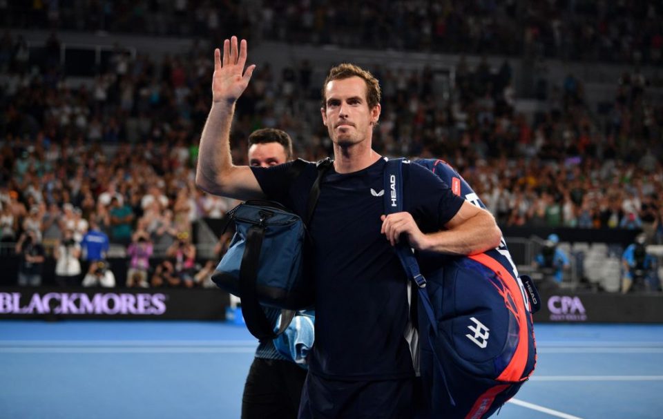 TOPSHOT - Britain's Andy Murray waves to supporters after his defeat against Spain's Roberto Bautista Agut during their men's singles match on day one of the Australian Open tennis tournament in Melbourne on January 14, 2019. (Photo by SAEED KHAN / AFP) / -- IMAGE RESTRICTED TO EDITORIAL USE - STRICTLY NO COMMERCIAL USE --        (Photo credit should read SAEED KHAN/AFP/Getty Images)
