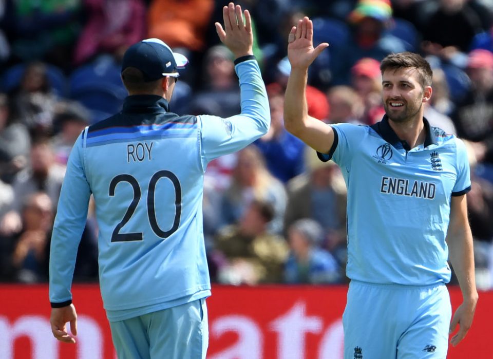 England's Mark Wood (R) celebrates with teammate Jason Roy after the dismissal of Bangladesh's Tamim Iqbal during the 2019 Cricket World Cup group stage match between England and Bangladesh at Sophia Gardens stadium in Cardiff, south Wales, on June 8, 2019. (Photo by Paul ELLIS / AFP) / RESTRICTED TO EDITORIAL USE        (Photo credit should read PAUL ELLIS/AFP/Getty Images)