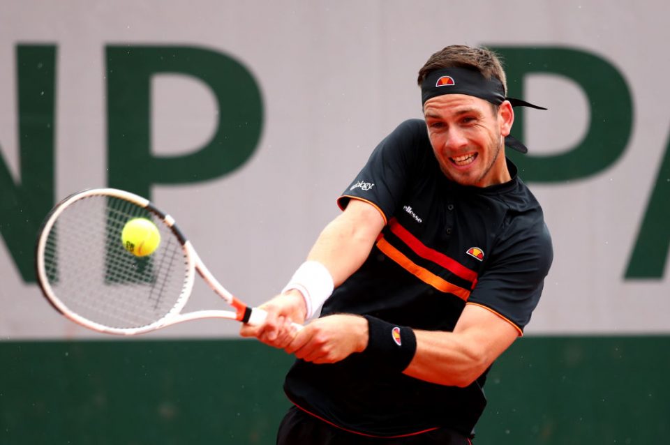 PARIS, FRANCE - MAY 28: Cameron Norrie of Great Britain plays a backhand during his mens singles first round match against Elliot Benchetrit of France during Day three of the 2019 French Open at Roland Garros on May 28, 2019 in Paris, France. (Photo by Clive Brunskill/Getty Images)