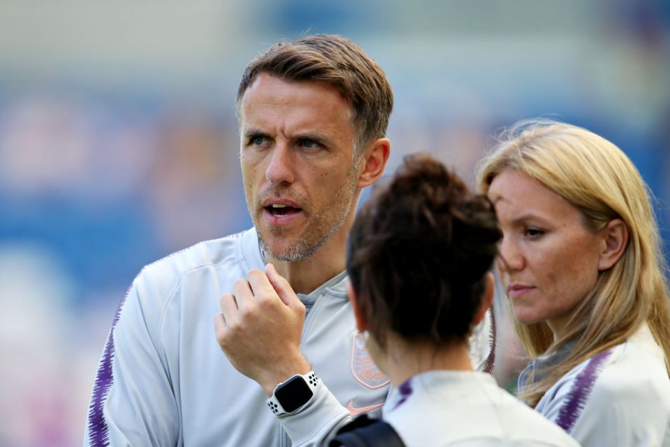 BRIGHTON, ENGLAND - JUNE 01: Manager of England Women Phil Neville talks with his assistants before the International Friendly between England Women and New Zealand Women at Amex Stadium on June 01, 2019 in Brighton, England. (Photo by Steve Bardens/Getty Images)