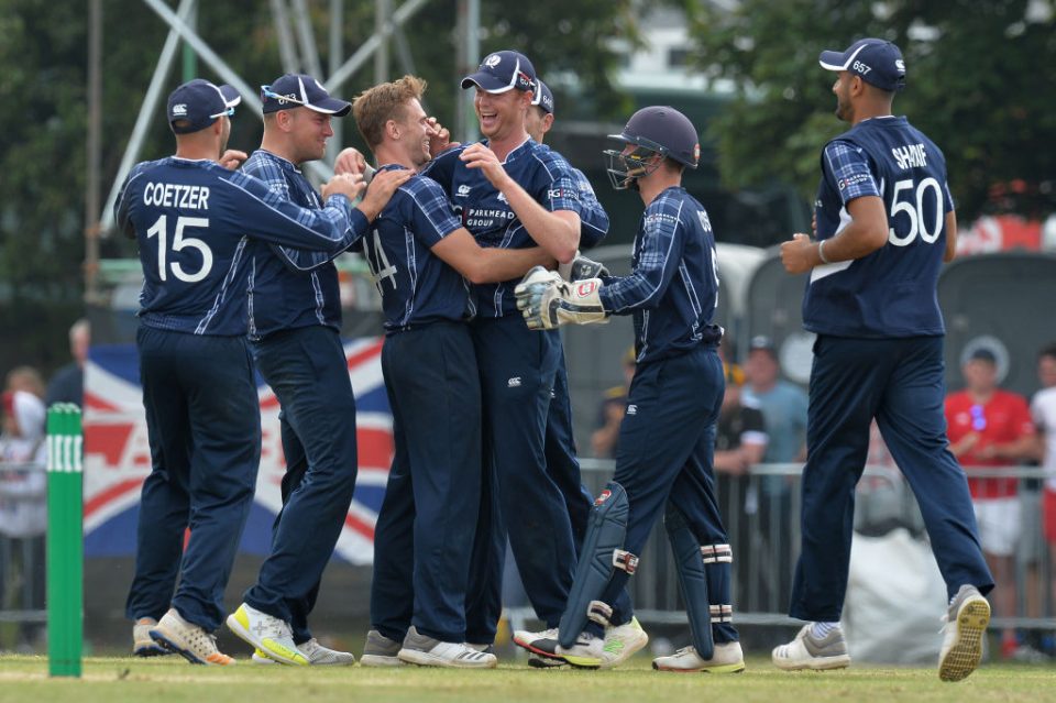 EDINBURGH, SCOTLAND - JUNE 10: Alasdair Evans (L4), and Richie Berrington (L3), of Scotland celebrate taking the wicket of Alex Hales with there team mates during the One Day International match between Scotland and England at The Grange on June 10, 2018 in Edinburgh, Scotland. (Photo by Mark Runnacles/Getty Images)