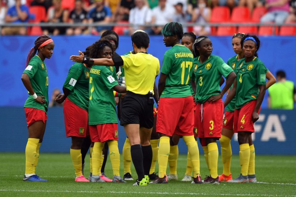 Chinese referee Qin Liang (C) validates a goal  during the France 2019 Women's World Cup round of sixteen football match between England and Cameroon, on June 23, 2019, at the Hainaut stadium in Valenciennes, northern France. (Photo by Philippe HUGUEN / AFP)        (Photo credit should read PHILIPPE HUGUEN/AFP/Getty Images)
