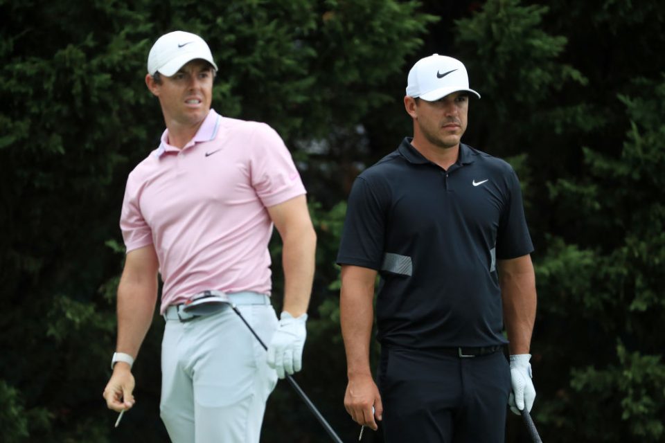 ATLANTA, GEORGIA - AUGUST 25: Brooks Koepka of the United States and Rory McIlroy of Northern Ireland look on from the eighth tee during the final round of the TOUR Championship at East Lake Golf Club on August 25, 2019 in Atlanta, Georgia. (Photo by Streeter Lecka/Getty Images)