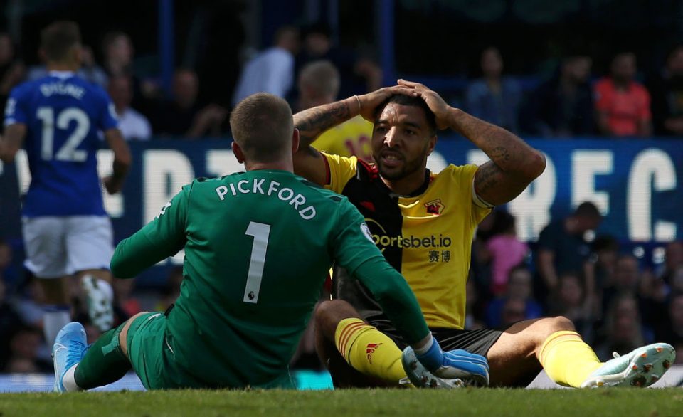 LIVERPOOL, ENGLAND - AUGUST 17: Troy Deeney of Watford and Jordan Pickford of Everton react during the Premier League match between Everton FC and Watford FC at Goodison Park on August 17, 2019 in Liverpool, United Kingdom. (Photo by Jan Kruger/Getty Images)
