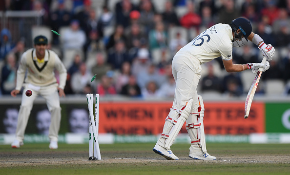 MANCHESTER, ENGLAND - SEPTEMBER 07: England batsman Joe Root is bowled by Australia bowler Pat Cummins for 0 during day four of the 4th Ashes Test Match between England and Australia at Old Trafford on September 07, 2019 in Manchester, England. (Photo by Stu Forster/Getty Images)