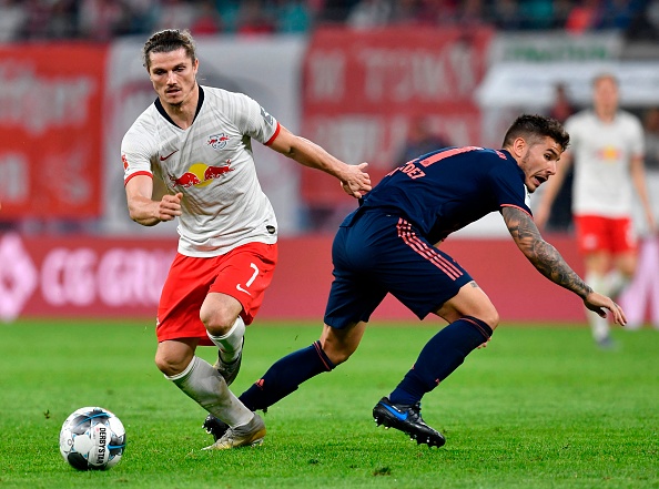 Leipzig's Austrian midfielder Marcel Sabitzer (L) vies with Bayern Munich's French defender Lucas Hernandez during the German first division Bundesliga football match RB Leipzig v FC Bayern Munich in Leipzig, eastern Germany on September 14, 2019. (Photo by John MACDOUGALL / AFP) / RESTRICTIONS: DFL REGULATIONS PROHIBIT ANY USE OF PHOTOGRAPHS AS IMAGE SEQUENCES AND/OR QUASI-VIDEO        (Photo credit should read JOHN MACDOUGALL/AFP/Getty Images)