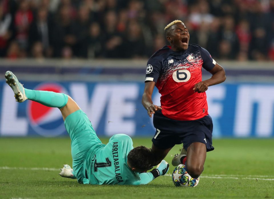LILLE, FRANCE - OCTOBER 02: Victor Osimhen of Lille is tackled by Kepa Arrizabalaga of Chelsea during the UEFA Champions League group H match between Lille OSC and Chelsea FC at Stade Pierre Mauroy on October 02, 2019 in Lille, France. (Photo by Naomi Baker/Getty Images)