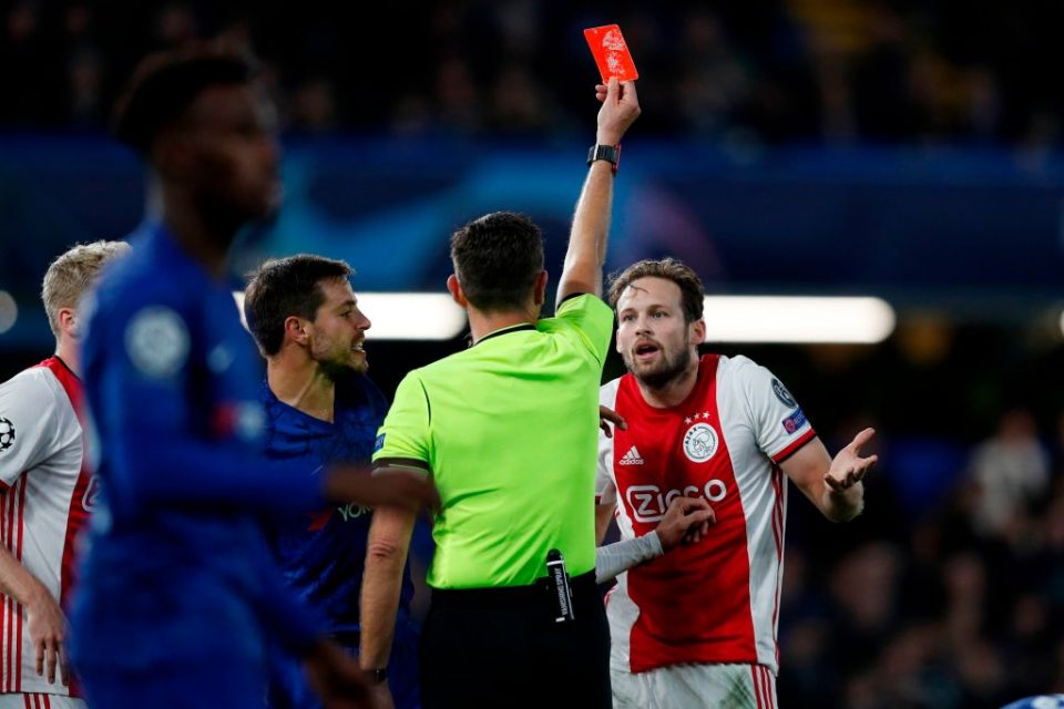 Ajax's Dutch defender Daley Blind (R) reacts as he is shown a red card by Italian referee Gianluca Rocchi during the UEFA Champion's League Group H football match between Chelsea and Ajax at Stamford Bridge in London on November 5, 2019. (Photo by Adrian DENNIS / AFP) (Photo by ADRIAN DENNIS/AFP via Getty Images)
