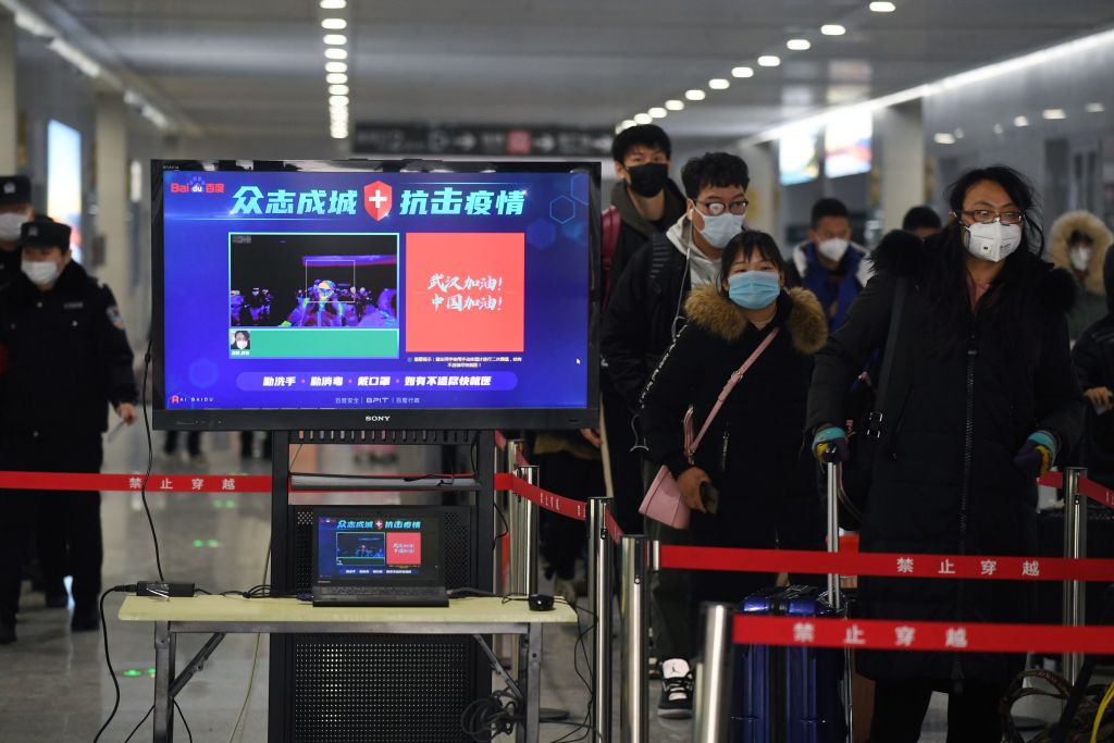 Covid-19: Coronavirus checks installed at a Beijing railway stations to test passengers for fevers